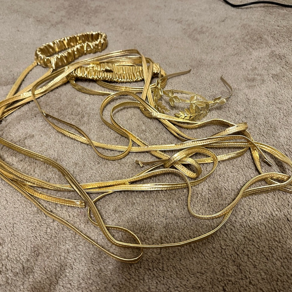 2 gold garters, leg wraps  Gold headband and arm band